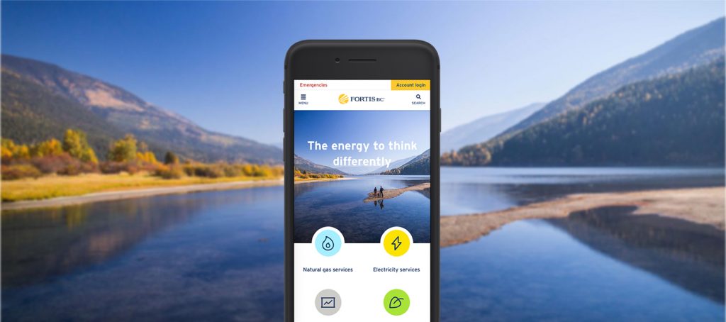 mobile phone screen against a landscape showing fortisbc.com website redesign