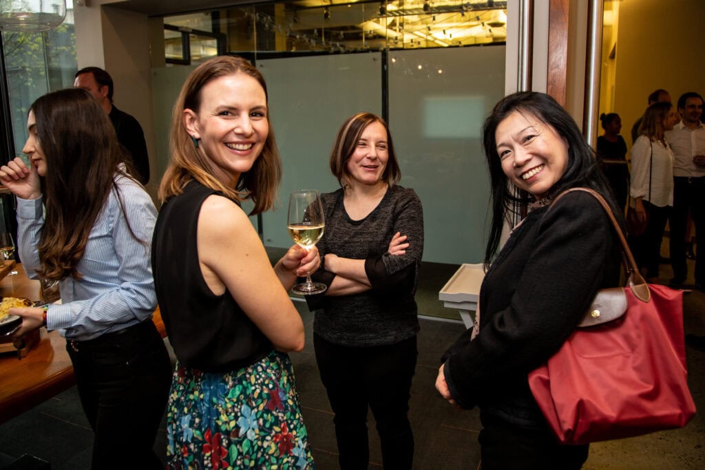 Photo of three female OXD staff laughing