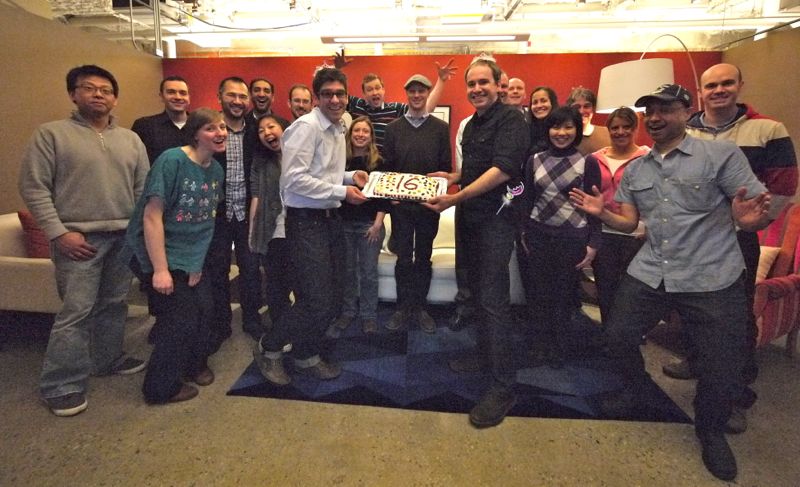 Photo of staff celebrating 16 year anniversary for company