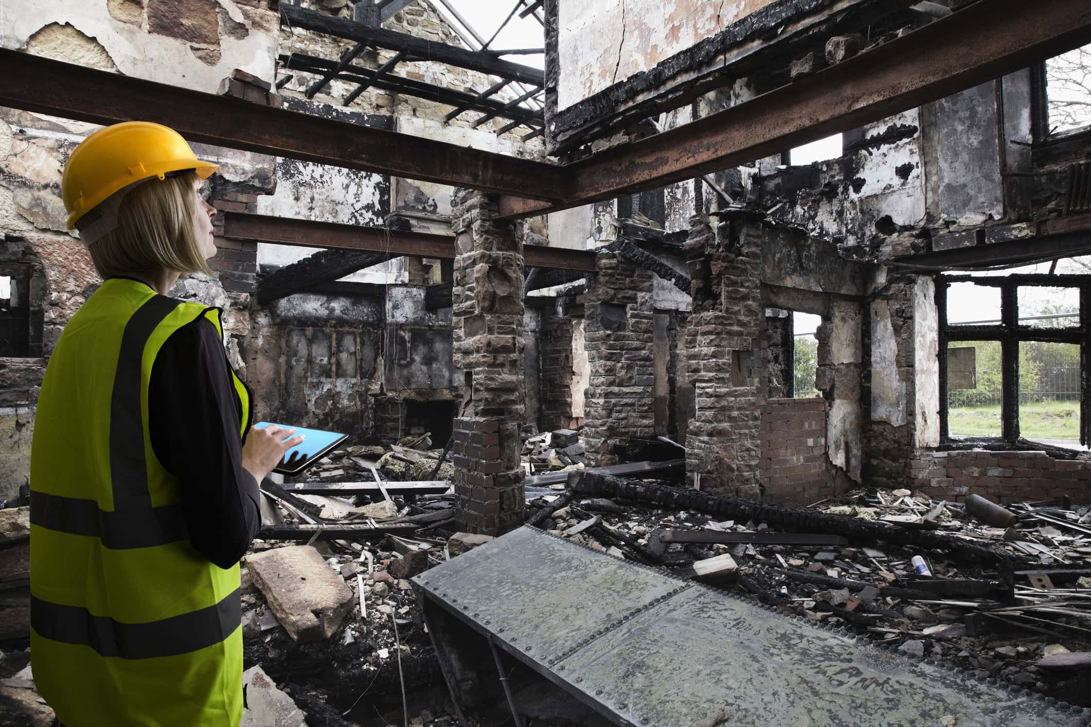 Woman assessing damage from a fire