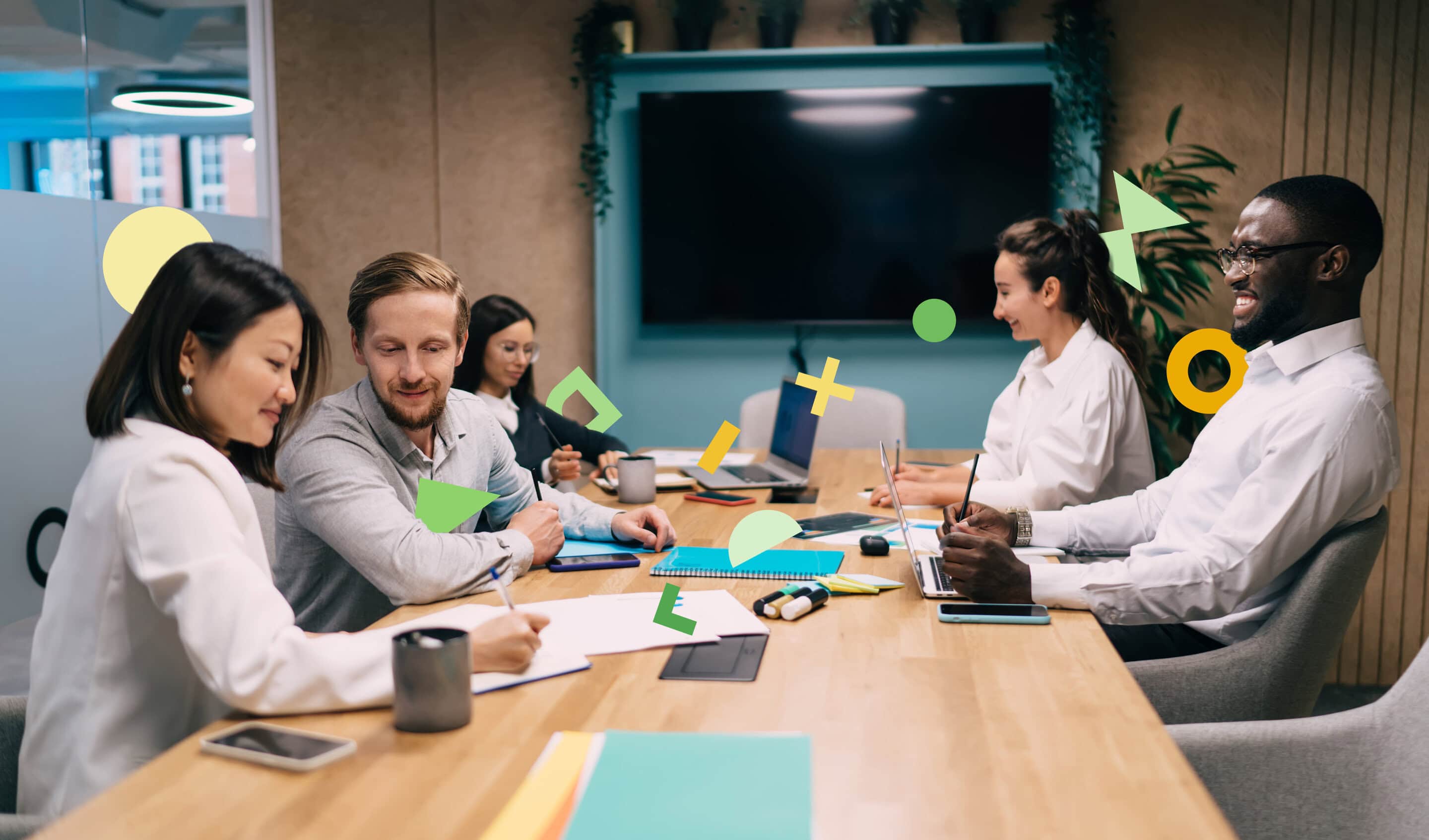 People sitting around a boardroom table, working and collaborating, signifying all the different knowledge bases required to define quality criteria.