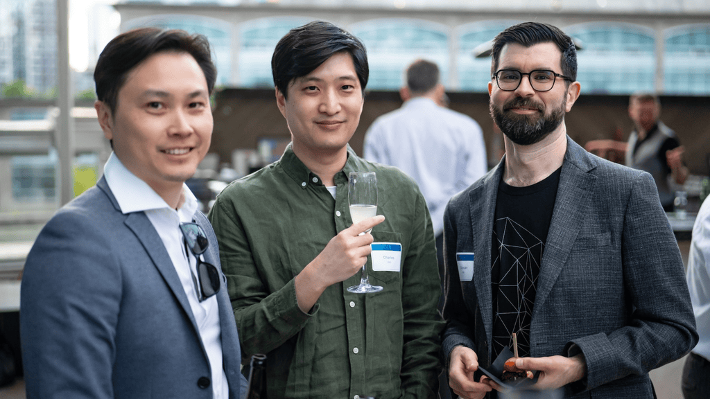 Three of OXD's developers chatting at our 30th anniversary party
